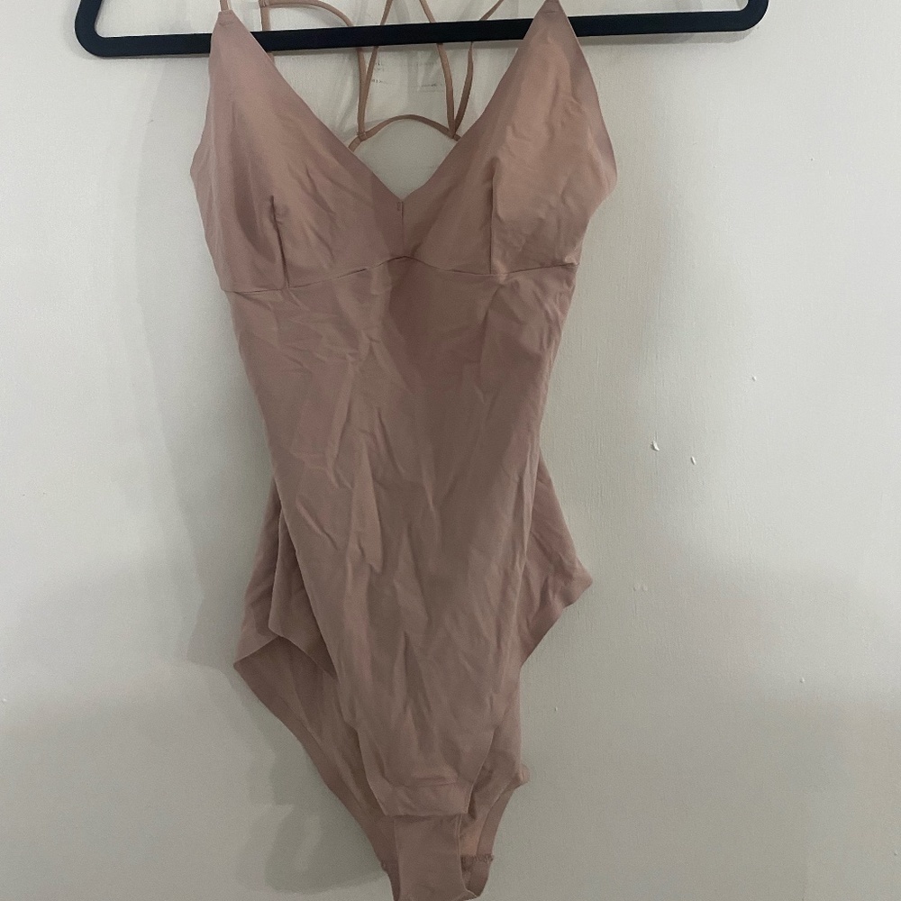 5 pale pink body suit